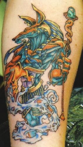 Nice Colored Anubis Tattoo On Forearm
