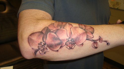 Nice Grey Ink Orchid Flower Tattoo On Right Arm