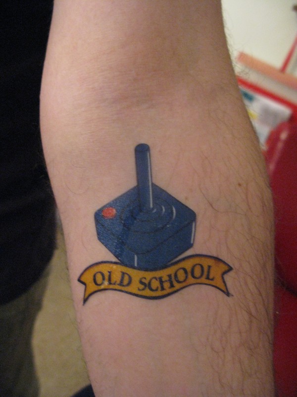 Old School Geek Tattoo On Forearm