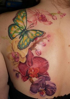Orchid Tattoo On Left Back Shoulder