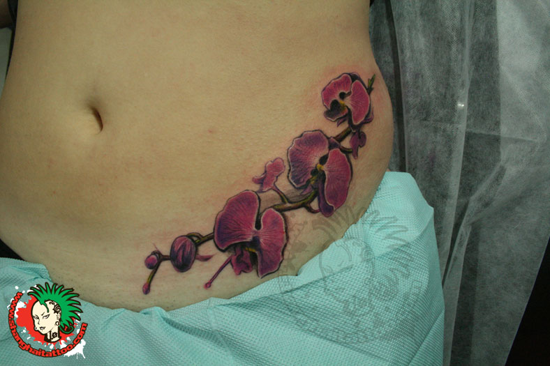 Orchid Tattoos On Girl Left Hip