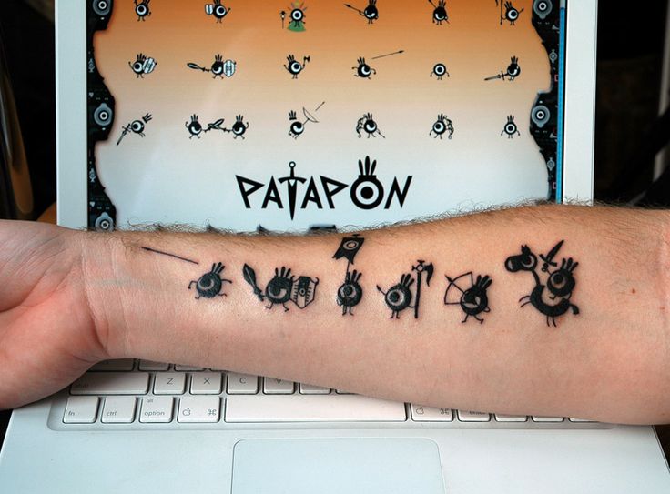 Patapon Computer Geek Tattoo On Right Forearm