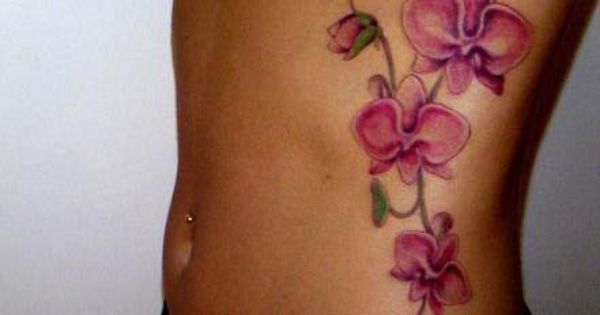 Pink Orchid Tattoo On Girl Side Rib