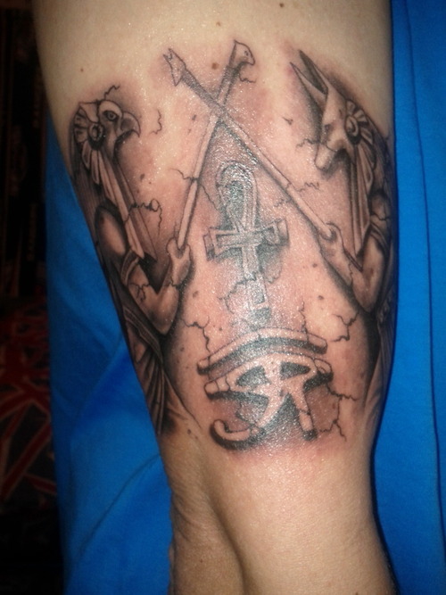 Realistic Grey Ink Anubis and Horus Tattoos On Bicep