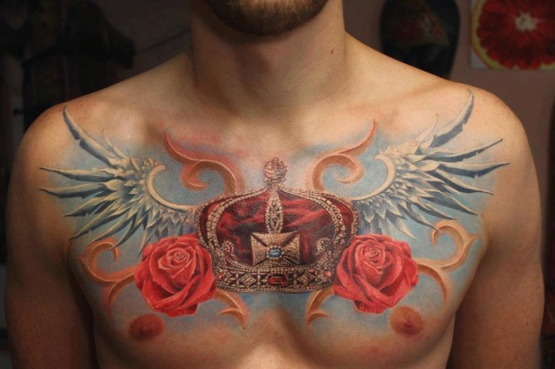 Realistic King Crown With Wings And Roses Tattoo On Man Chest by Alexandr Pashkov