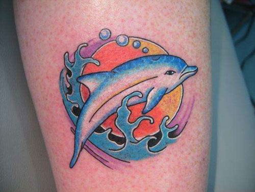 Rising Sun And Dolphin Tattoo On Leg