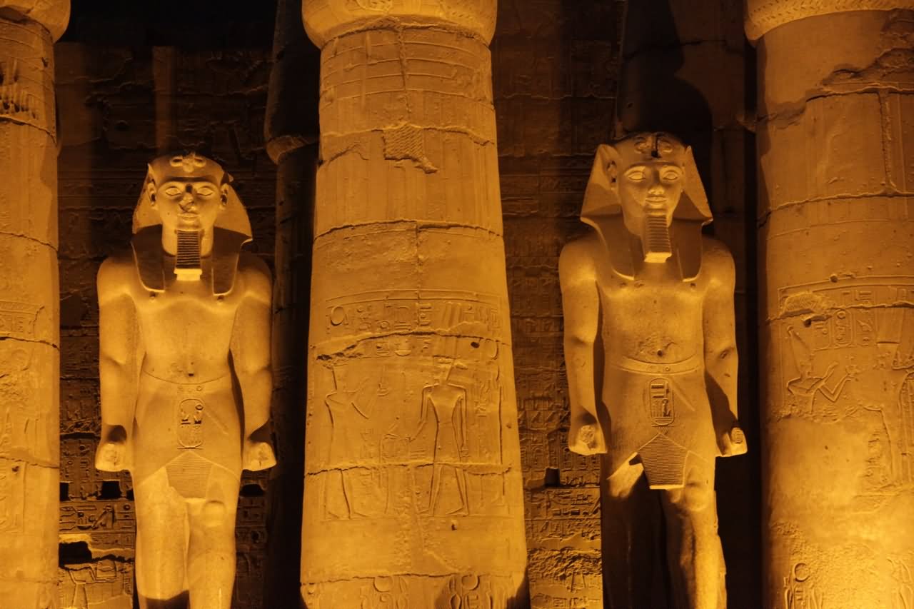 Sculptures And Pillars Lit Up At Night Inside The Luxor Temple