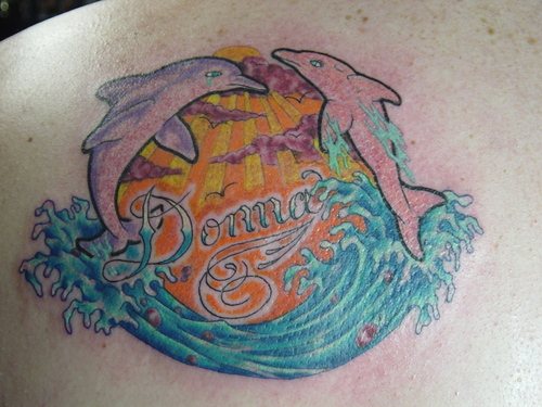 Sea Dolphin Tattoos On Back
