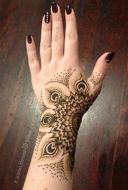 Simple Henna Flower Tattoo On Girl Left Hand