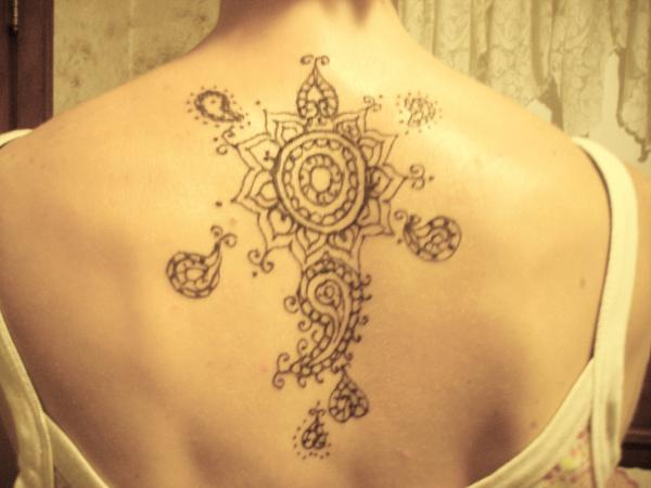 Simple Henna Flower Tattoo On Upper Back