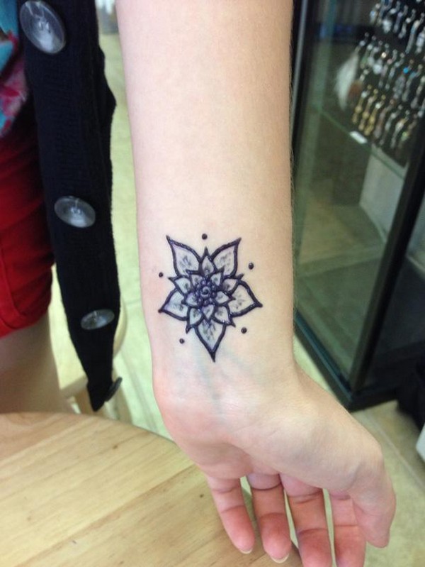 Simple Henna Flower Tattoo On Wrist
