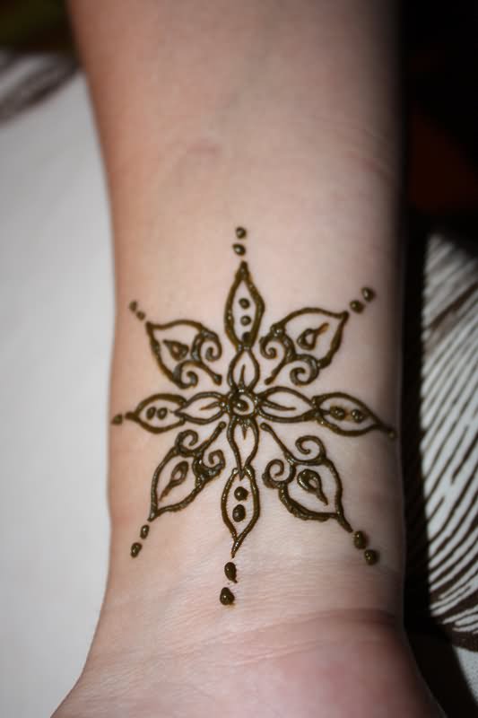 Simple Henna Flower Tattoo On Wrist
