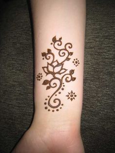 Simple Henna Lotus Tattoo On Wrist
