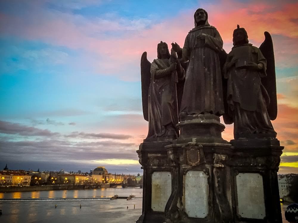 Statue At The Charles Bridge During Sunset Picture