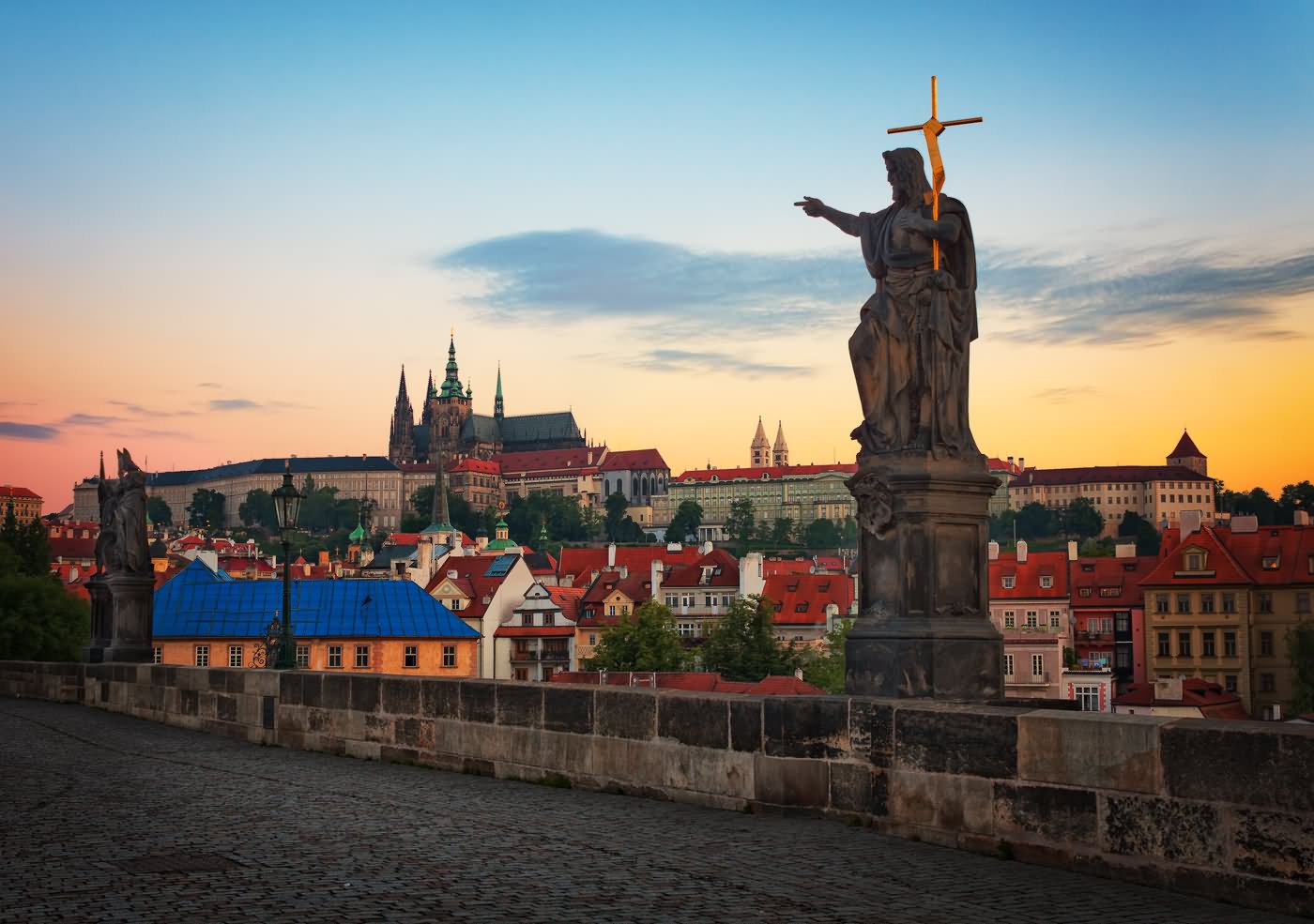 Statue On The Charles Bridge In Prague During Sunset