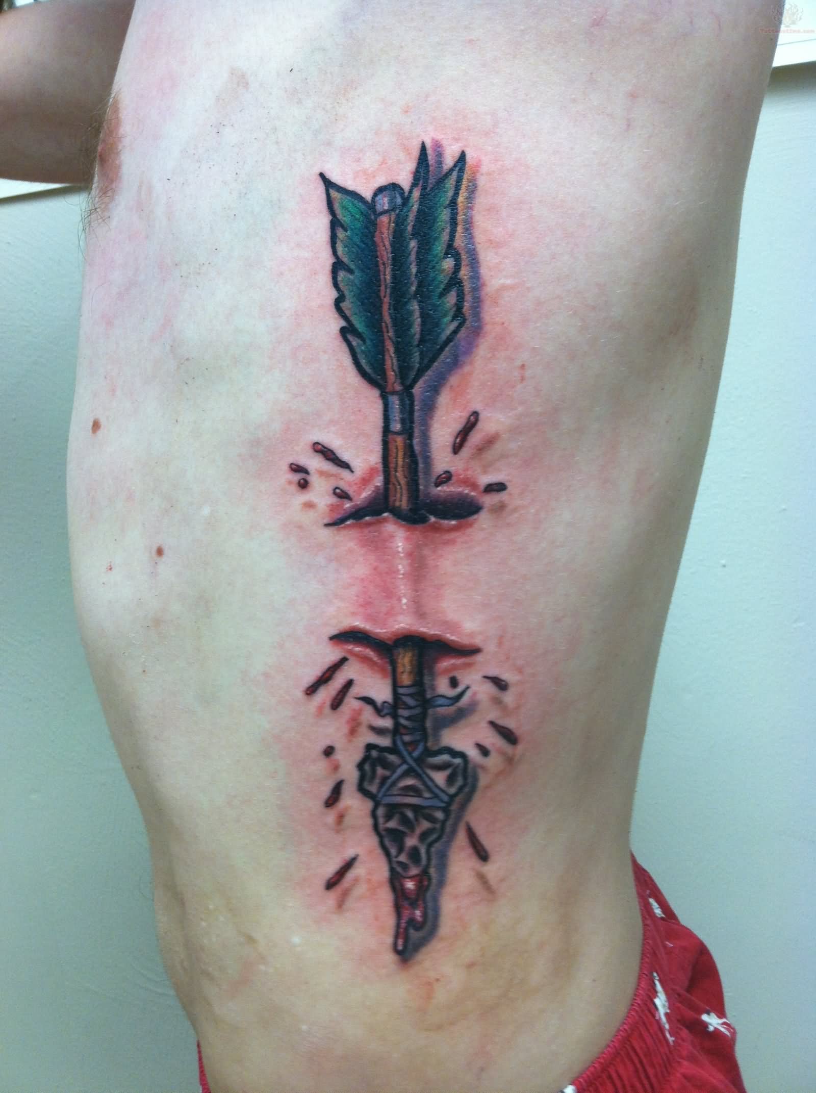 Torn Ripped Skin Arrow Tattoo On Man Side Rib