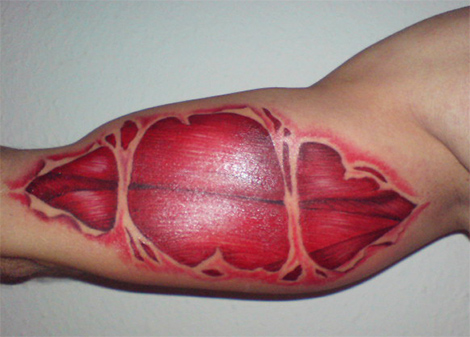 Torn Ripped Skin Muscle Tattoo Design For Bicep