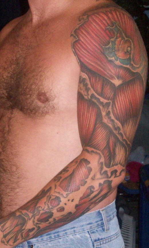 Torn Ripped Skin Muscle Tattoo On Left Full Sleeve