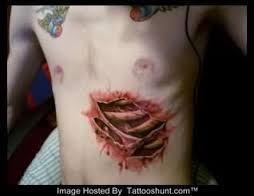 Torn Ripped Skin Rib Cage Tattoo On Stomach