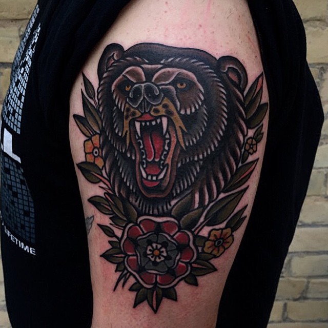 Traditional Roaring Bear With Flowers Tattoo On Half Sleeve