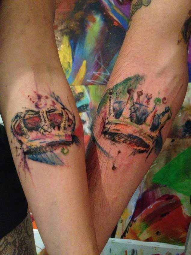 Watercolor King And Queen Crown Tattoo On Couple Arm