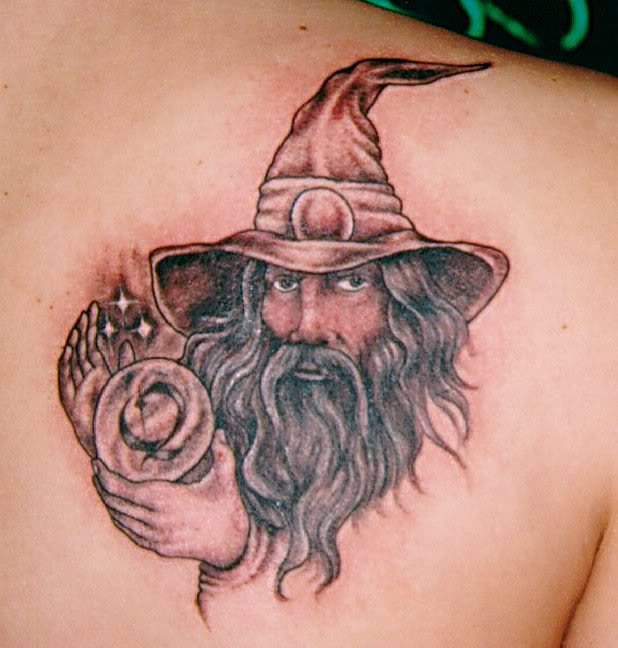 Wizard With Crystal Ball Tattoo On Back Shoulder