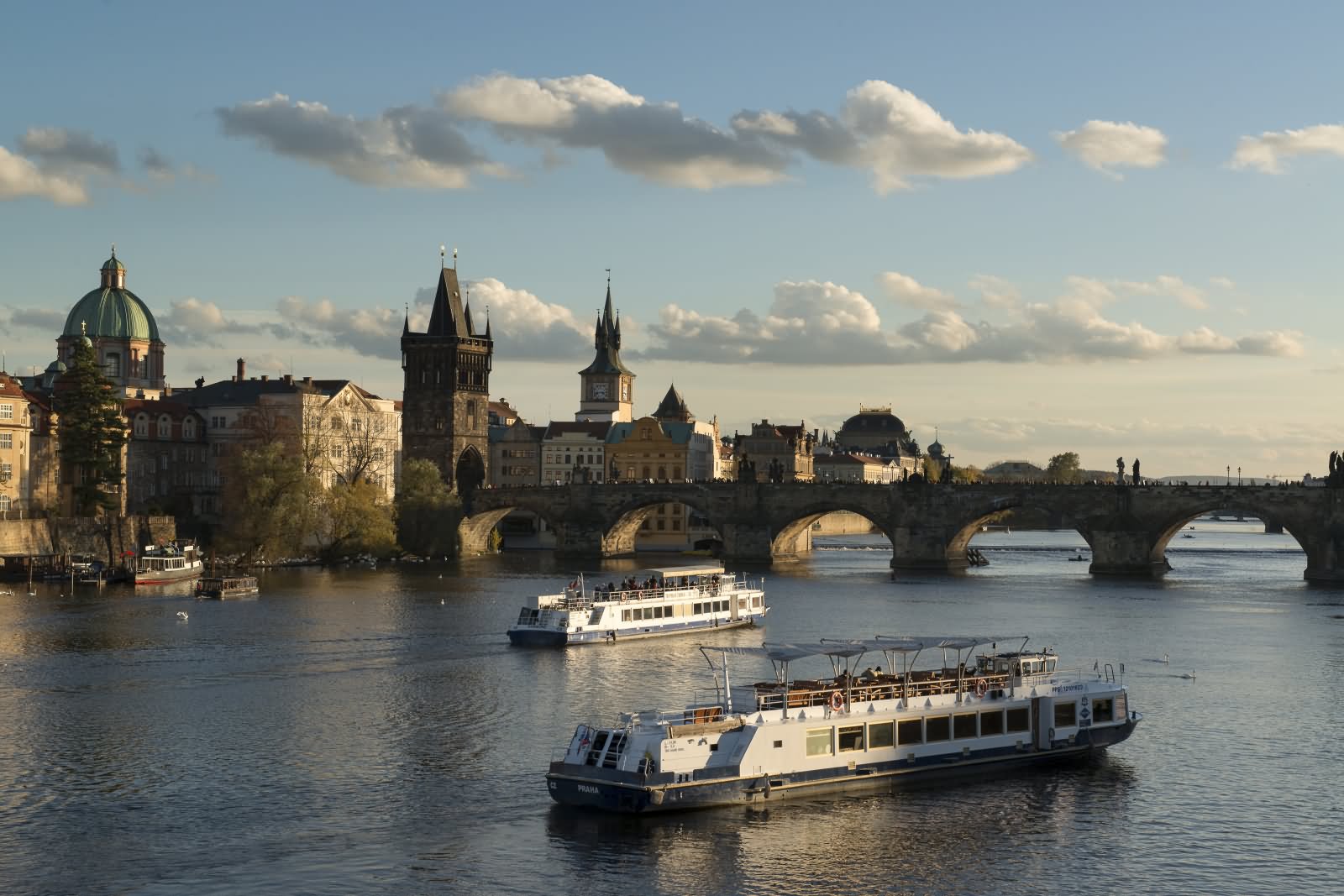 Yachts Passing Under The Charles Bridge In Prague