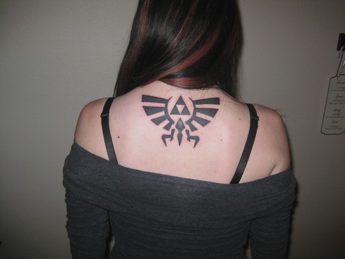 Zelda Crest Geek Tattoo On Girl Upper Back