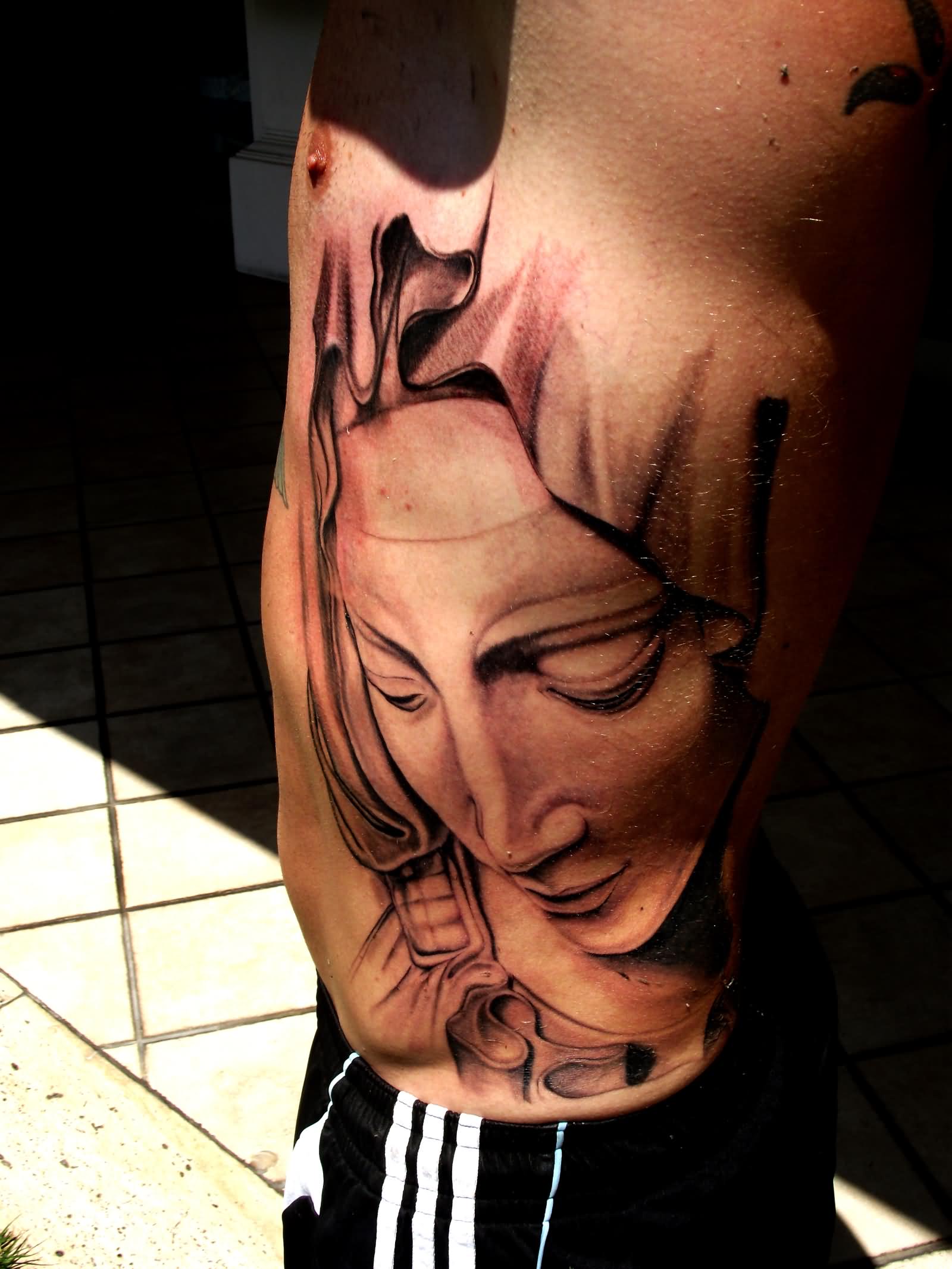 3D Saint Mary Face Tattoo On Man Side Rib By Mete Tungaz