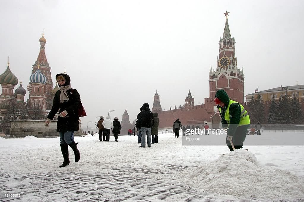 A Municipal Worker Cleans The Snow Near The Kremlin