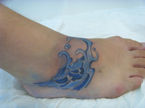 Amazing Blue Wave Tattoo On Right Foot