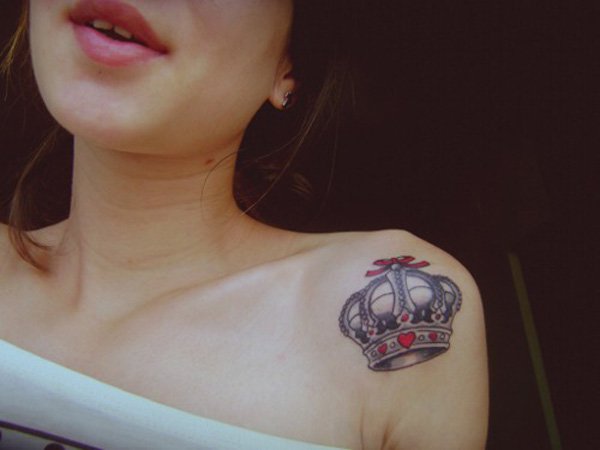 Attractive Queen Crown Tattoo On Girl Left Front Shoulder