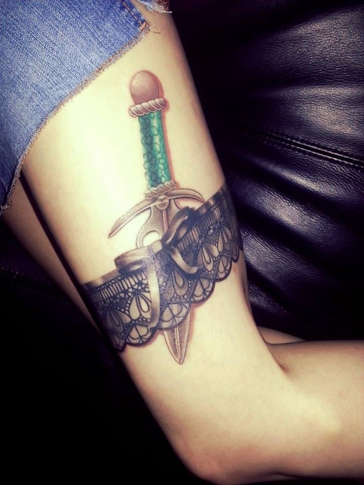 Awesome Dagger With Garter Belt Tattoo On Thigh