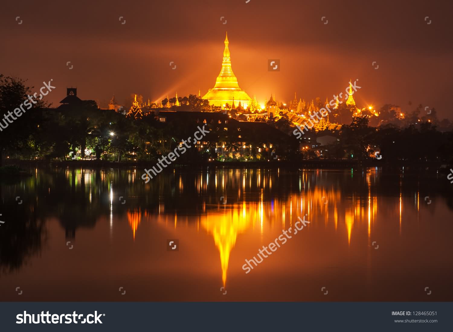 Beautiful Night View Of The Shwedagon Pagoda Across The Kandawgyi River In Myanmar