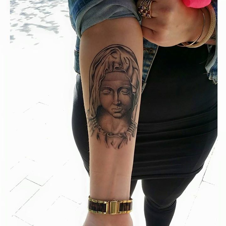 Black And Grey 3D Saint Mary Face Tattoo On Right Forearm