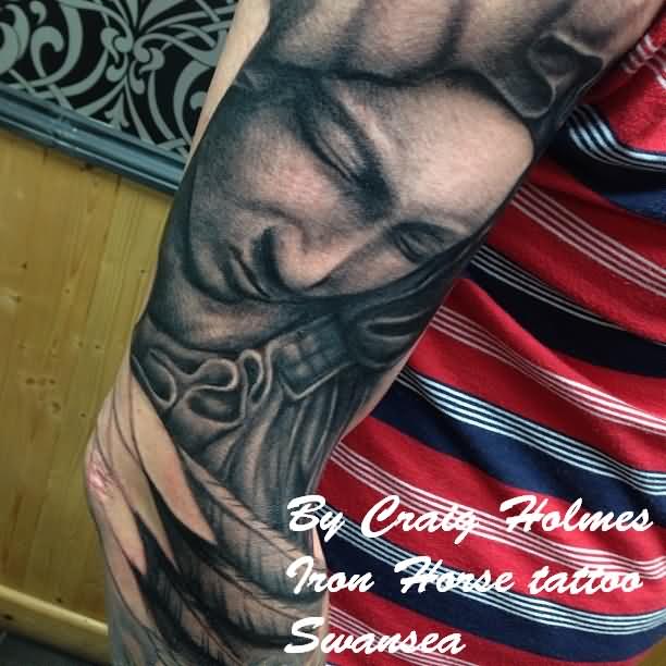 Black And Grey Saint Mary Face Tattoo On Right Half Sleeve By Craig Holmes