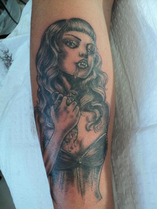 Black And Grey Vampire Girl Face Tattoo On Arm