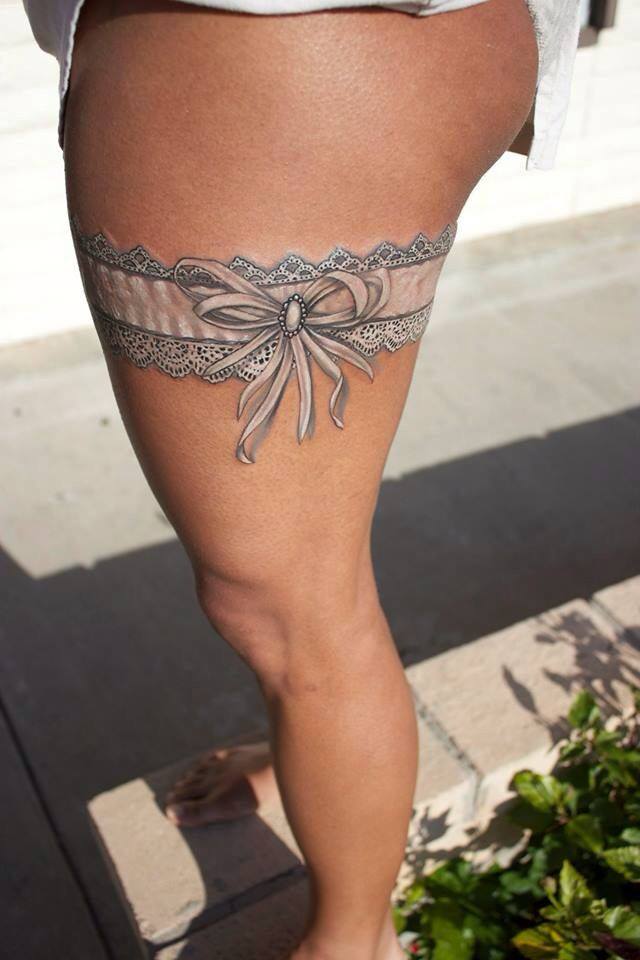 Black And White Country Garter Tattoo On Thigh