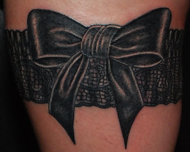 Black Bow Lace And Garter Tattoo On Thigh