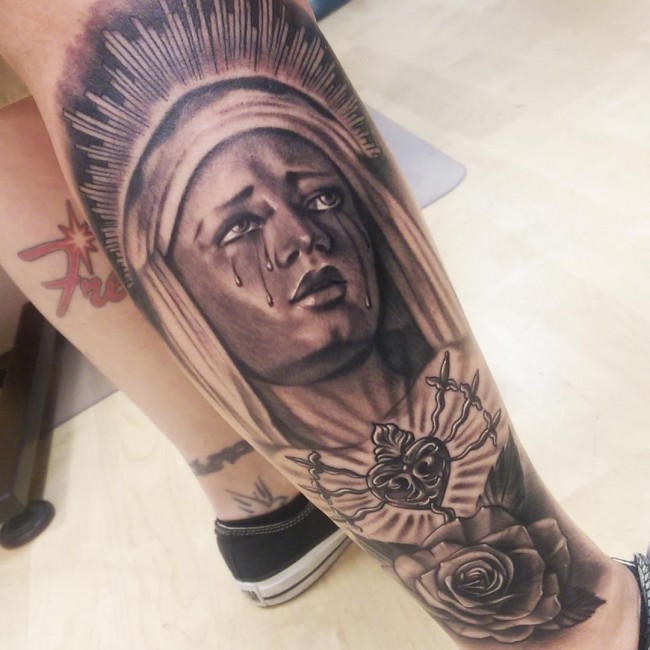 Black Ink Crying Saint Mary With Rose Tattoo On Right Leg