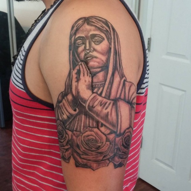 Black Ink Saint Mary With Roses Tattoo On Man Left Half Sleeve