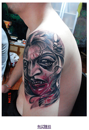Black Ink Vampire Face Tattoo On Man Left Shoulder