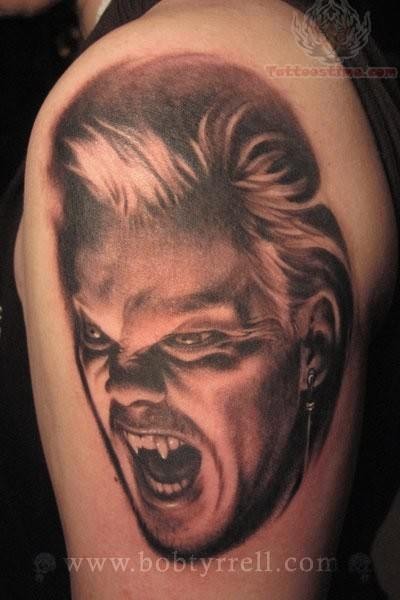 Black Ink Vampire Face Tattoo On Shoulder