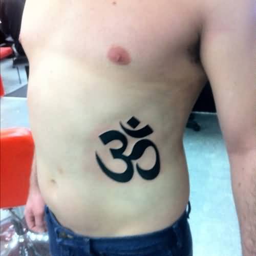 Black Om Symbol Tattoo On Man Side Rib