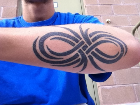 Black Tribal Infinity Symbol Tattoo Design For Men Forearm