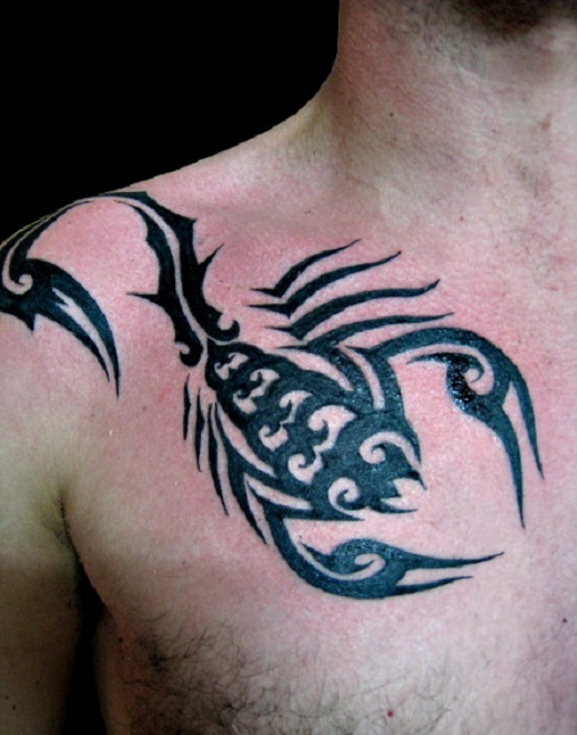 Black Tribal Scorpion Tattoo On Man Front Shoulder