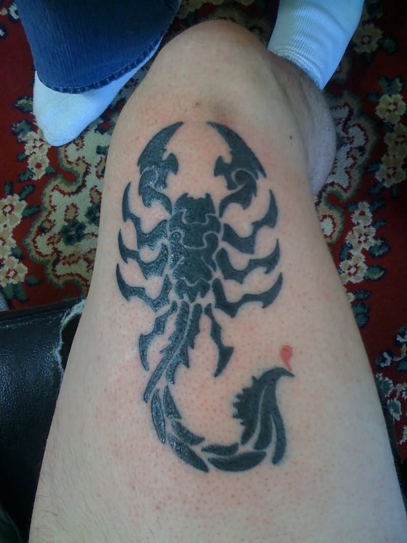 Black Tribal Scorpion Tattoo On Thigh