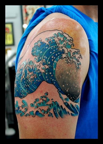 Blue Ink Wave Tattoo On Right Shoulder