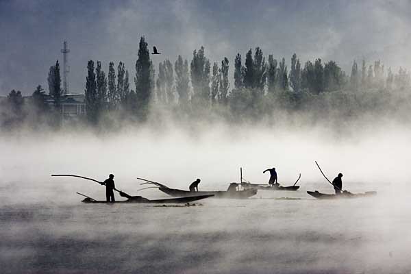 Boatmen On Early Morning In Dal Lake