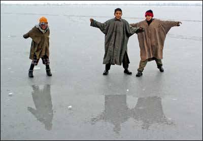 Children Playing On Frozen Dal Lake During Winter Season